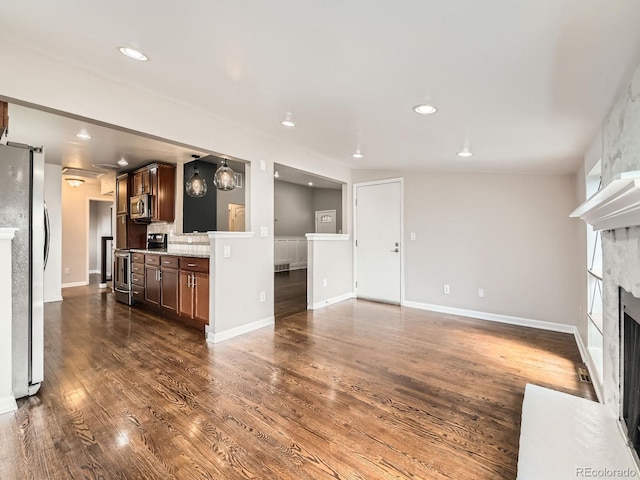 170 W Midway Blvd, Broomfield, CO 80020 - unfurnished living room featuring a fireplace, dark wood finished floors, baseboards, and recessed lighting