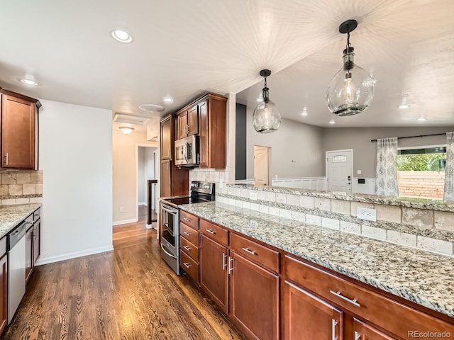 170 W Midway Blvd, Broomfield, CO 80020 - kitchen featuring stainless steel appliances, light stone counters, decorative backsplash, hanging light fixtures, and dark wood-type flooring