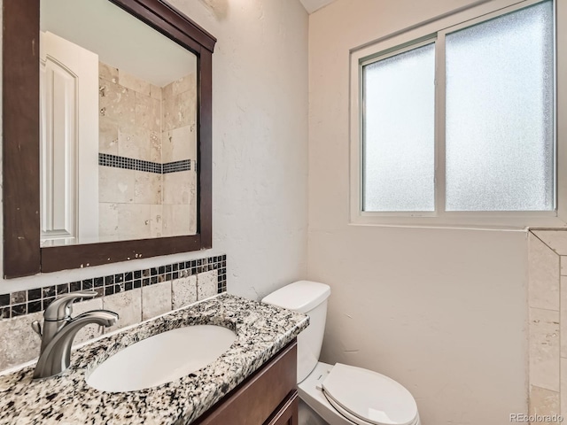 170 W Midway Blvd, Broomfield, CO 80020 - bathroom with decorative backsplash, toilet, vanity, and a shower