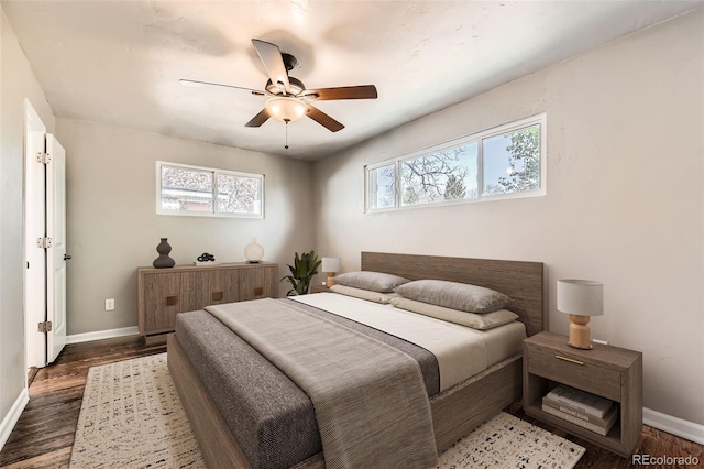 170 W Midway Blvd, Broomfield, CO 80020 - bedroom with multiple windows, baseboards, and wood finished floors