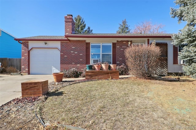 ranch-style home with brick siding, a chimney, concrete driveway, a garage, and a front lawn