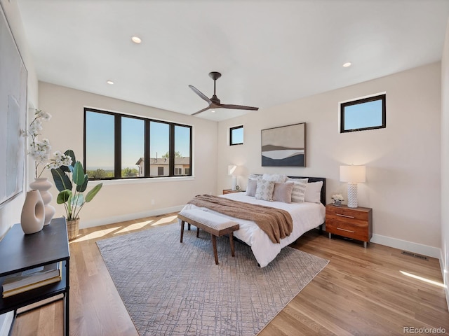 bedroom featuring ceiling fan and light hardwood / wood-style flooring