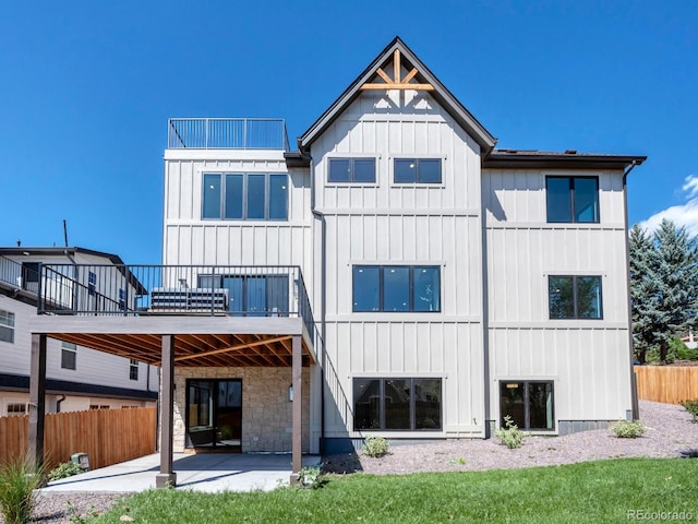 rear view of property featuring a patio