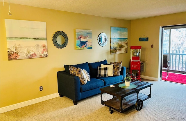 living room with carpet flooring and a textured ceiling