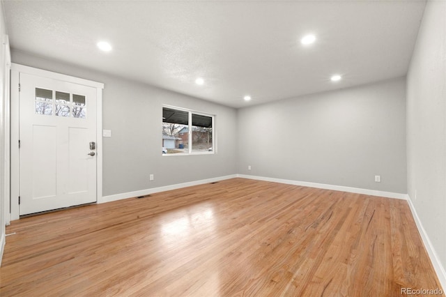 entryway with light hardwood / wood-style floors