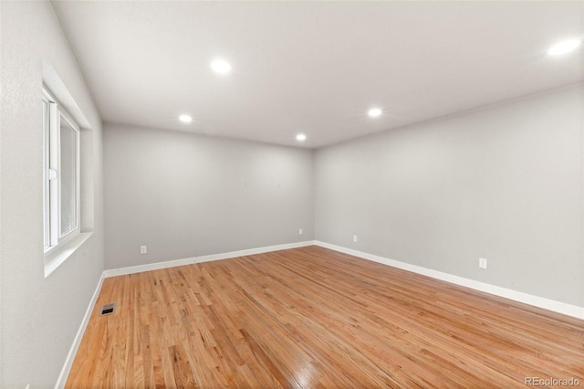 unfurnished room featuring light hardwood / wood-style floors