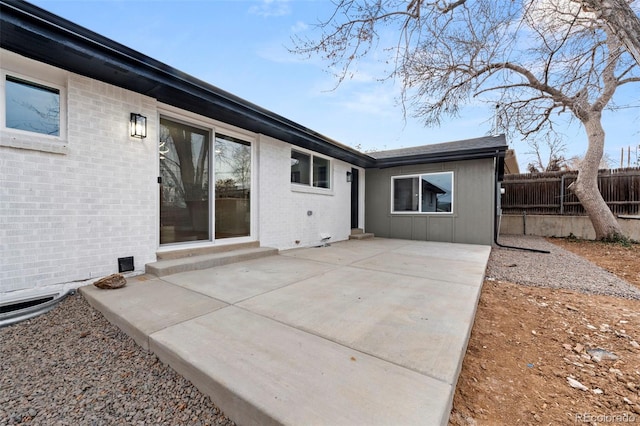 rear view of property featuring a patio