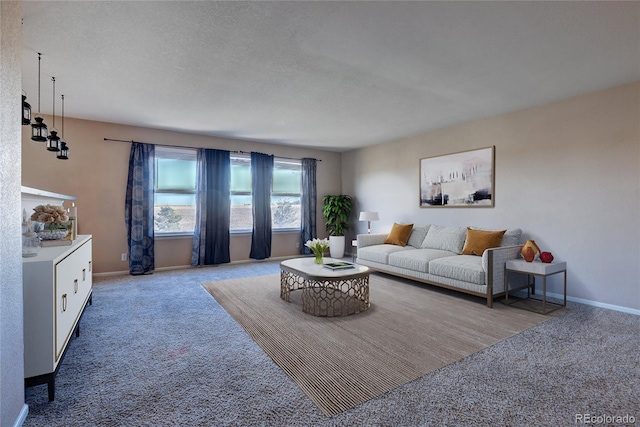 carpeted living room featuring a textured ceiling