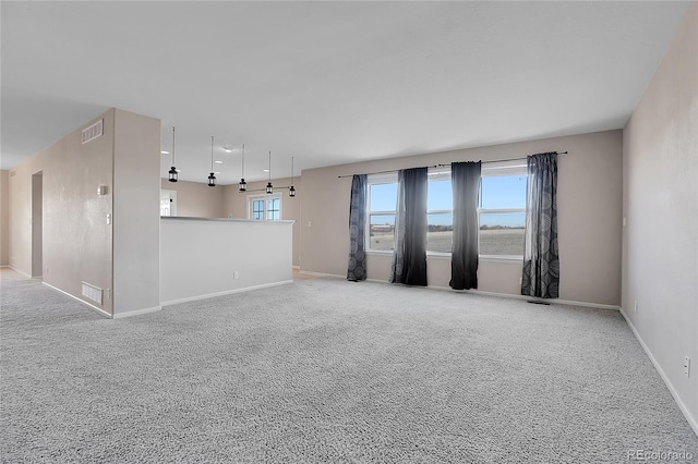 unfurnished living room with light carpet