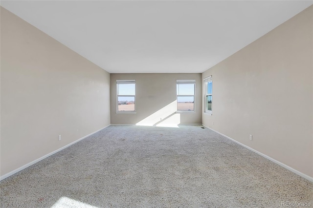 unfurnished room with carpet floors