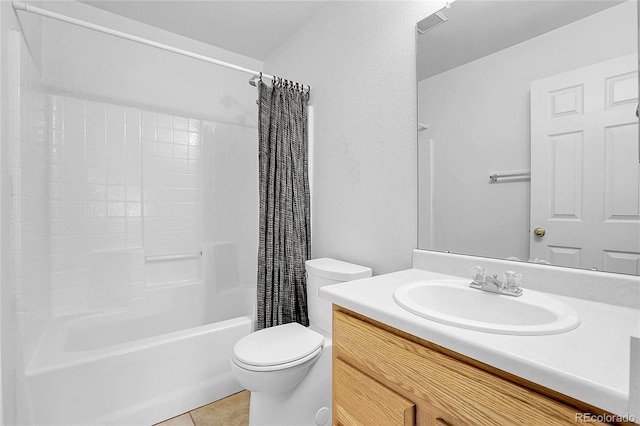 full bathroom with shower / bath combo with shower curtain, tile patterned flooring, vanity, and toilet