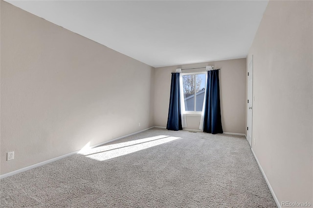 spare room with light carpet