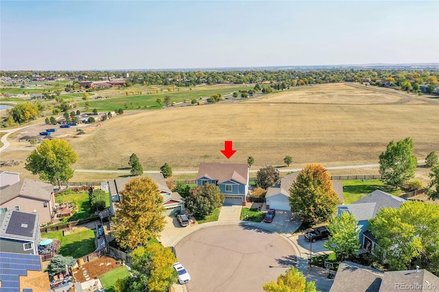 birds eye view of property with a rural view