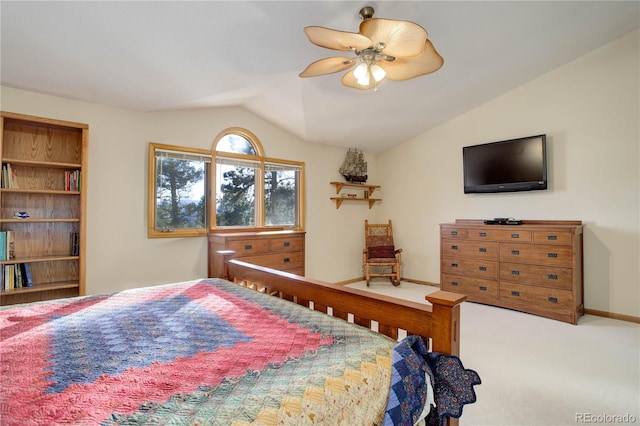 bedroom with ceiling fan, carpet floors, and vaulted ceiling