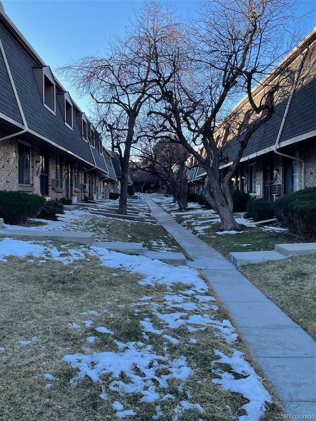 view of property's community featuring a yard