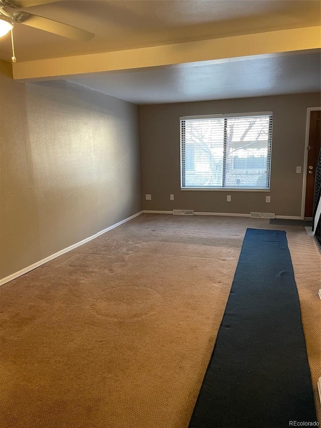 spare room with ceiling fan and carpet flooring