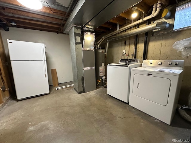 laundry area featuring separate washer and dryer, heating unit, and gas water heater