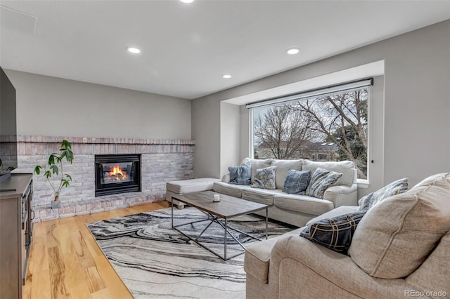 5075 Weeping Willow Cir, Highlands Ranch, CO 80130 - living area with wood finished floors, recessed lighting, and a fireplace