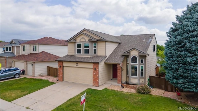 5075 Weeping Willow Cir, Highlands Ranch, CO 80130 - view of front of home featuring brick siding, concrete driveway, an attached garage, and a shingled roof