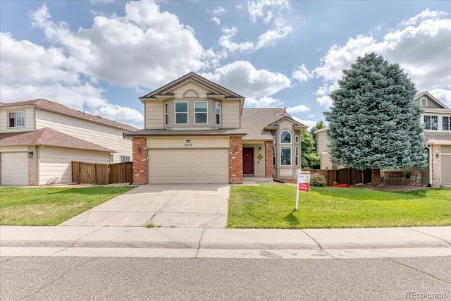 5075 Weeping Willow Cir, Highlands Ranch, CO 80130 - view of front facade with brick siding, driveway, an attached garage, and roof with shingles