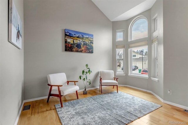 5075 Weeping Willow Cir, Highlands Ranch, CO 80130 - living area with wood finished floors and high vaulted ceiling