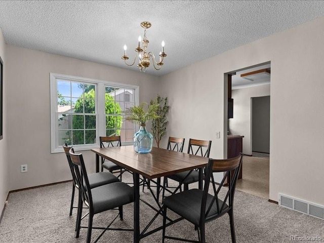 7101 W Yale Ave Unit 1305, Denver, CO 80227 - carpeted dining space with a chandelier and a textured ceiling