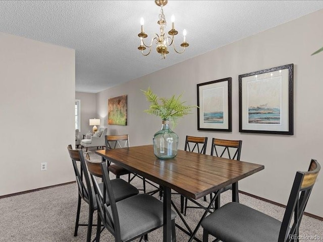 7101 W Yale Ave Unit 1305, Denver, CO 80227 - carpeted dining area featuring a chandelier and a textured ceiling