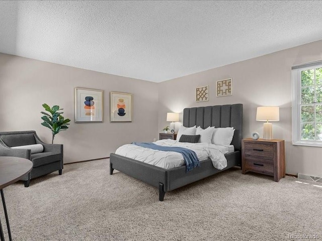 7101 W Yale Ave Unit 1305, Denver, CO 80227 - carpeted bedroom with a textured ceiling