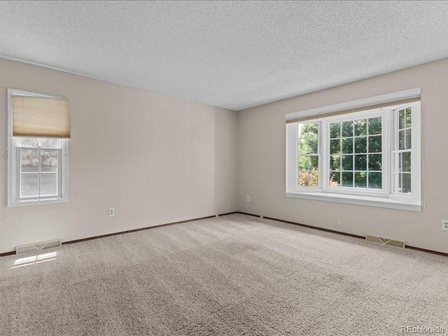 7101 W Yale Ave Unit 1305, Denver, CO 80227 - carpeted spare room with a textured ceiling and baseboards