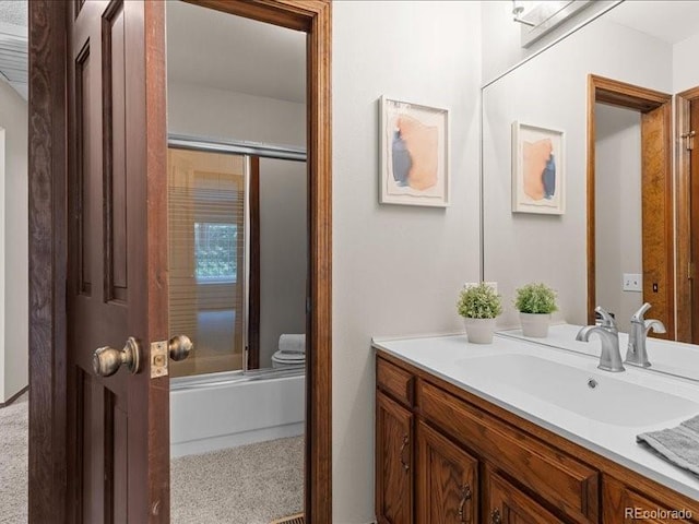 7101 W Yale Ave Unit 1305, Denver, CO 80227 - bathroom featuring vanity and combined bath / shower with glass door