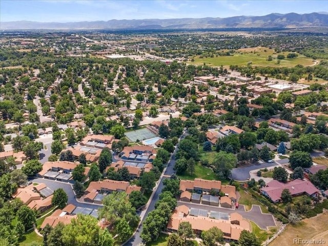 7101 W Yale Ave Unit 1305, Denver, CO 80227 - aerial view of property and surrounding area with a mountain backdrop and nearby suburban area