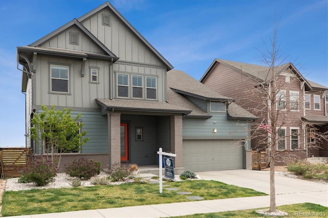 craftsman-style home featuring an attached garage, fence, concrete driveway, board and batten siding, and roof with shingles