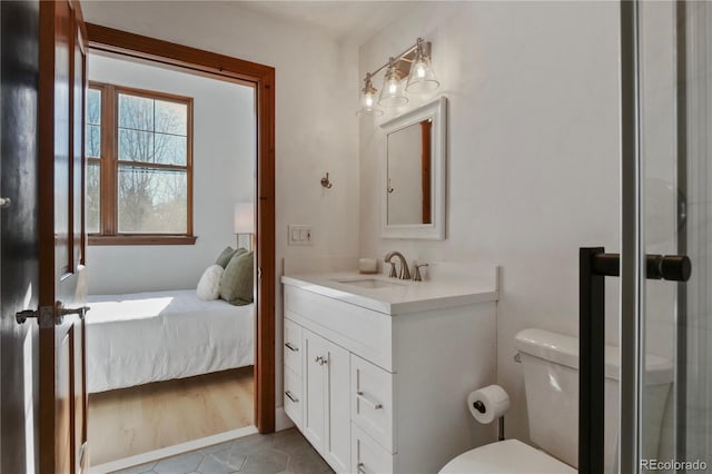 bathroom featuring vanity and toilet