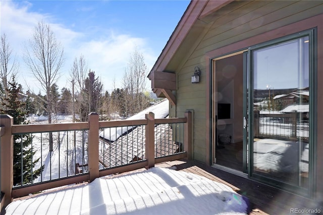 view of snow covered deck