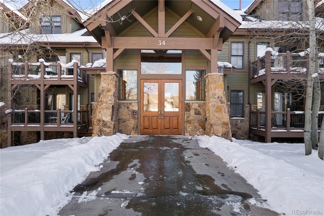 view of snow covered property entrance