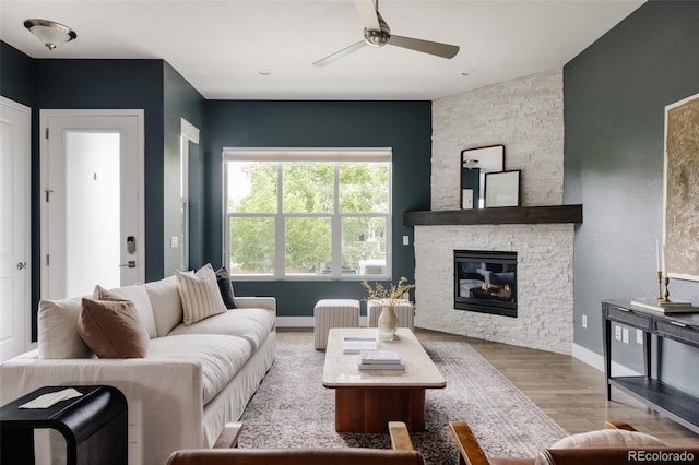 3473 Beeler St, Denver, CO 80238 - living room with a ceiling fan, wood finished floors, and a stone fireplace