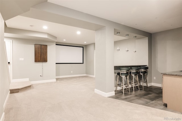 3473 Beeler St, Denver, CO 80238 - carpeted home theater room featuring a bar and recessed lighting