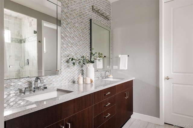 3473 Beeler St, Denver, CO 80238 - bathroom with double vanity, a shower stall, and backsplash