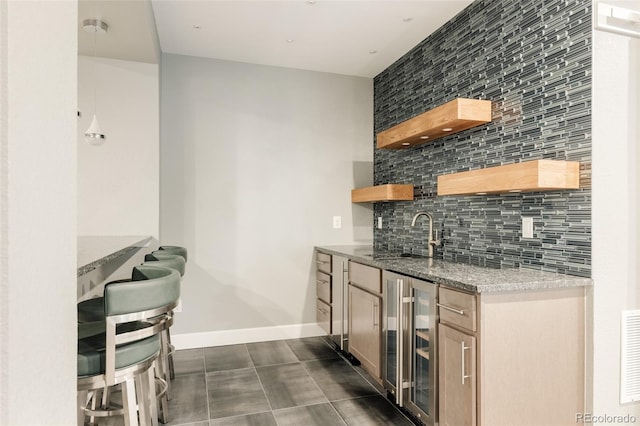 3473 Beeler St, Denver, CO 80238 - indoor wet bar featuring wine cooler, tasteful backsplash, and dark tile patterned flooring