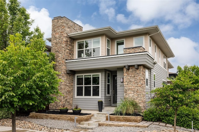 3473 Beeler St, Denver, CO 80238 - view of front of house with stone siding and a chimney