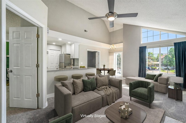4076 S Carson St Unit H, Aurora, CO 80014 - living area featuring carpet floors, ceiling fan, a textured ceiling, and high vaulted ceiling