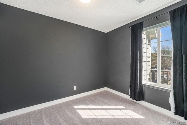 4076 S Carson St Unit H, Aurora, CO 80014 - spare room featuring a textured ceiling and carpet floors