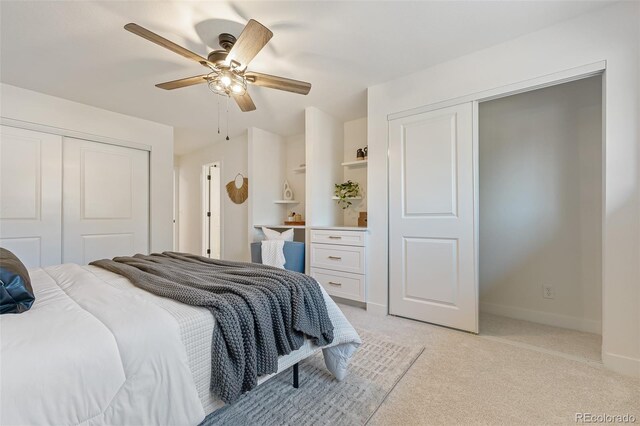 carpeted bedroom featuring ceiling fan and a closet