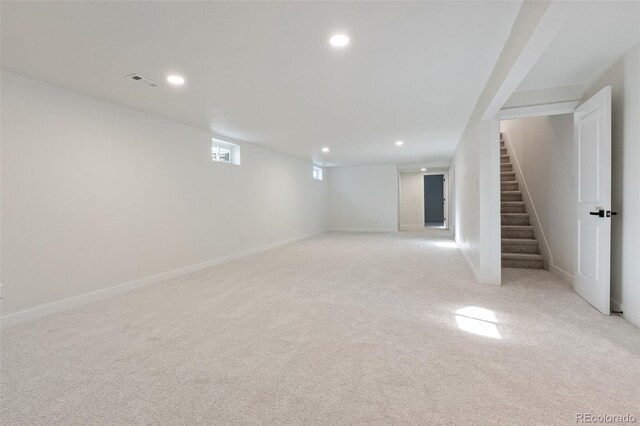 basement with light colored carpet