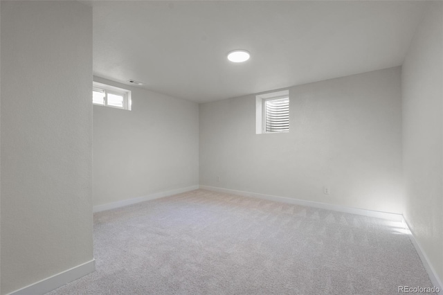 basement with light colored carpet