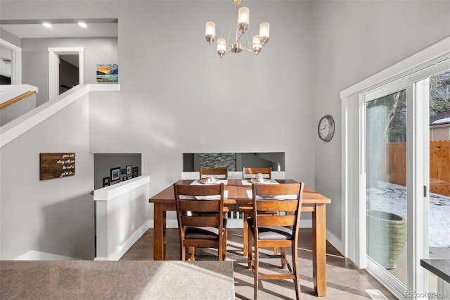 dining space with a chandelier