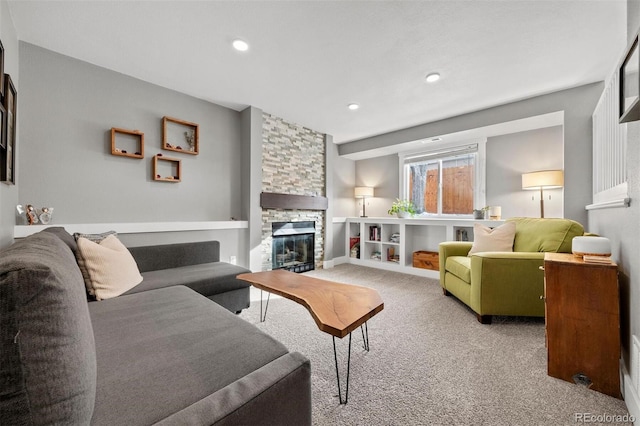 carpeted living room with a fireplace