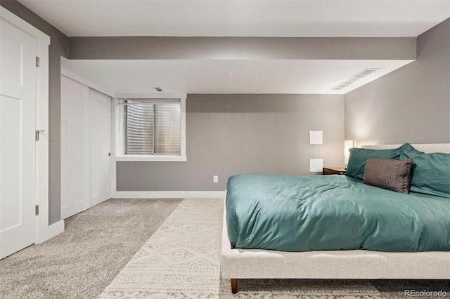 bedroom with light colored carpet