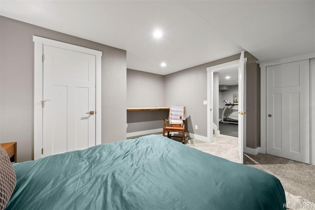 bedroom featuring light colored carpet