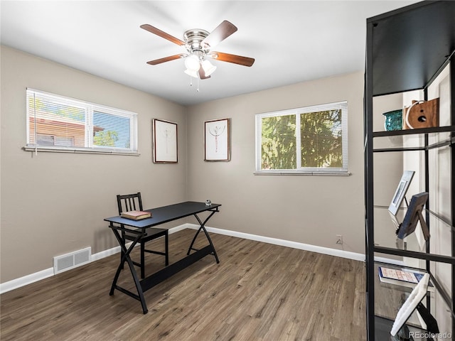 2695 S Logan St, Denver, CO 80210 - office area with healthy amount of natural light, wood finished floors, a ceiling fan, and baseboards